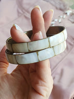 Load image into Gallery viewer, Brass and nacre pair of bangle vintage bracelets
